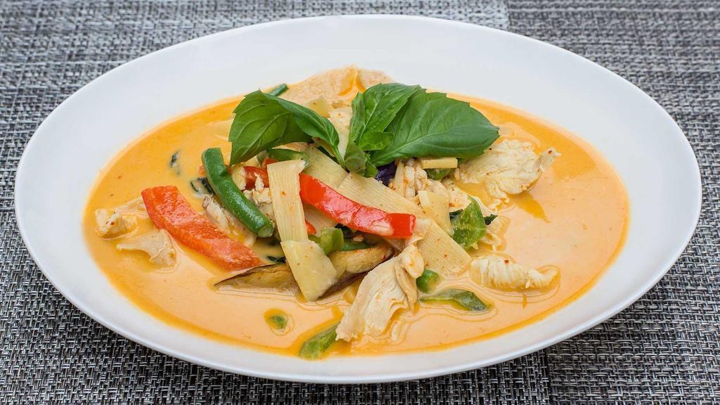 Red Curry · Red curry bamboo shoots, eggplant, green beans, bell peppers, and Thai basil with a red curry sauce.