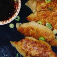 Chicken Gyoza (6 Pc) · Choice of steamed or fried filled with chicken, cabbage, ginger, and green onions served wit...