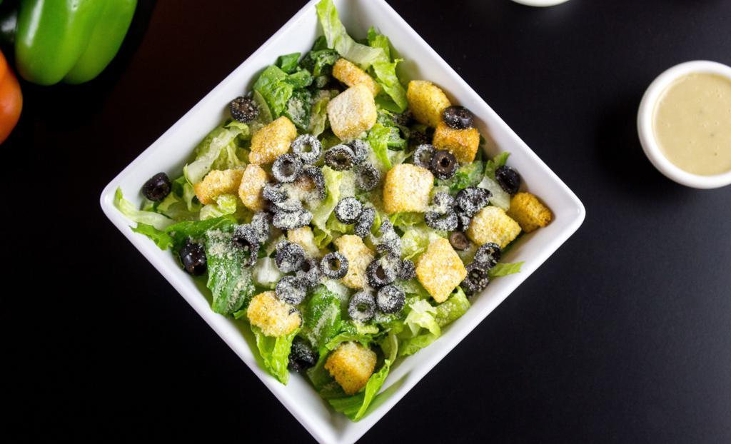 Caesar Salad (Large) · Romaine lettuce, croutons, black olives, Parmesan cheese. Included a side of Garlic Bread and Side of Dressing.  Add protein for an additional charge.