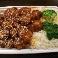 Sesame Chicken · Crispy chicken specially prepared and blended with mouth watering brown sauce covered with s...