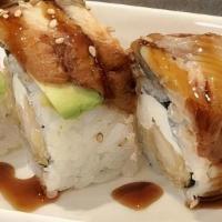 Ninja Roll · Tempura shrimp and cream cheese topped with eel, avocado and ell sauce.