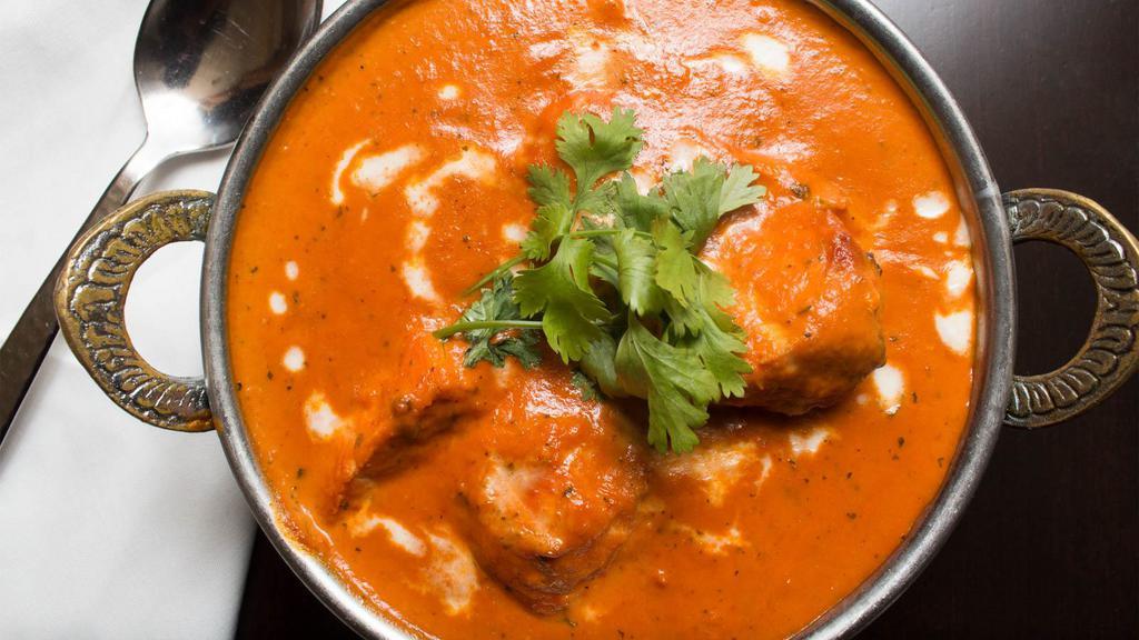 Chicken Tikka Masala · Tender chicken breast marinated in spices and yogurt, baked in a tandoor oven and cooked in a tomato based creamy sauce.