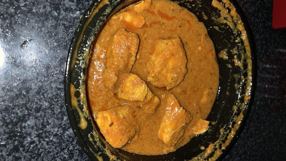 Chicken Curry · Tender chicken pieces cooked with spices and herbs.