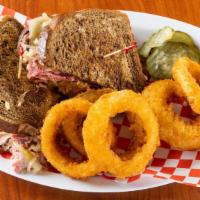 Reuben Sandwich · Thinly sliced corned beef on rye, melted swiss cheese, sauerkraut, and Thousand Island dress...