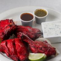 Tandoori Chicken · Chicken leg quarters marinated in fresh spices, herbs, and yogurt, barbecued over flaming ch...