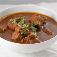 Curry Sauce · Staple Indian sauce cooked with fresh onion, tomato, ginger, garlic and simmered in Indian s...