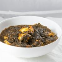 Palak Channa · Vegan. Spinach and channa (chickpeas) curry in Indian spices, and herbs. Served with basmati...