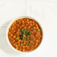 Kadahi Channa · Vegan. Lightly spiced sauce chickpeas cooked with mixed green bell pepper, onion, tomato, an...