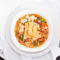 Tortilla Soup · Made with chunks of chicken, rice, pico de gallo, mixed veggies, avocado, tortillas and chee...