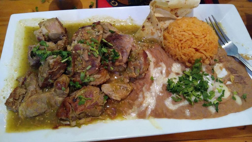 Pork - Puerco Carnitas Dinner · Pork tips. Served with rice, beans, tortillas and guacamole salad.