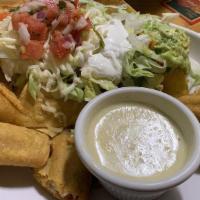 Flautas · Four corn tortillas, deep fried and rolled with chicken. Served with a guacamole salad and s...