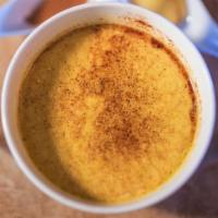 Golden Turmeric Latte · Turmeric, ginger, cinnamon, pepper, coconut oil, and honey cooked with almond/cashew milk