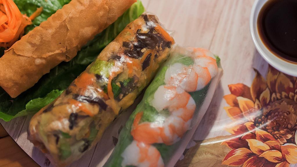 Combo Rolls (3 Cuốn) · An egg roll, spring roll and summer roll with sauces on the side
Spring roll has peanut sauce