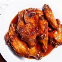 Wings (12) · Crispy wings plain fried or cooked in our delicious sauces (Asia Wings pictured)