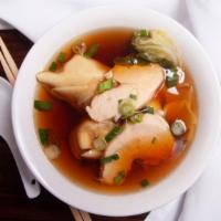 Wonton Soup · Hearty, pork-filled wontons with sliced chicken breast and lettuce in a savory broth