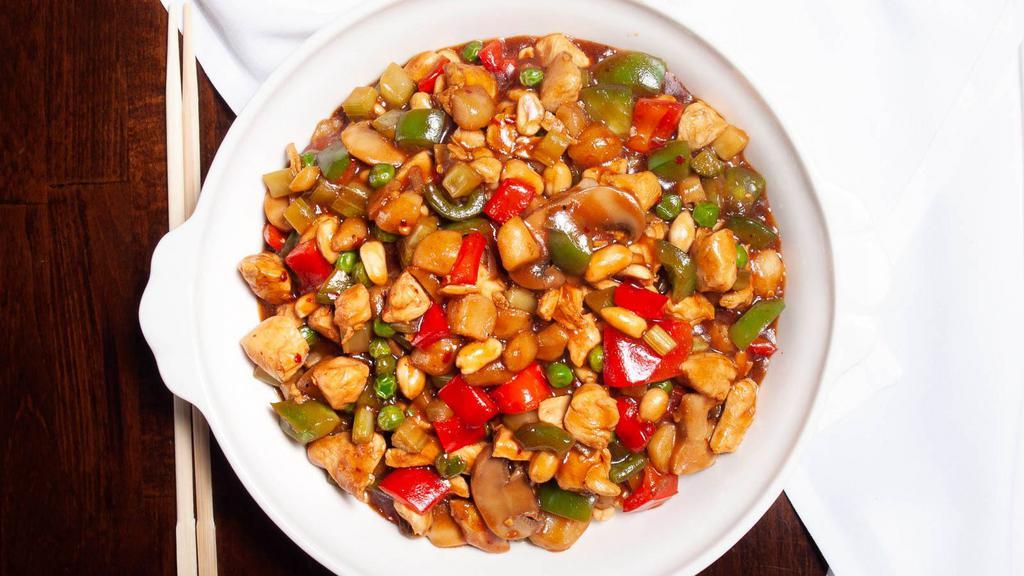 Kung Po Chicken And Peanuts · Cubes of white meat chicken with diced vegetables and spicy peppers, stir-fried quickly over high heat with peanuts and chili sauce