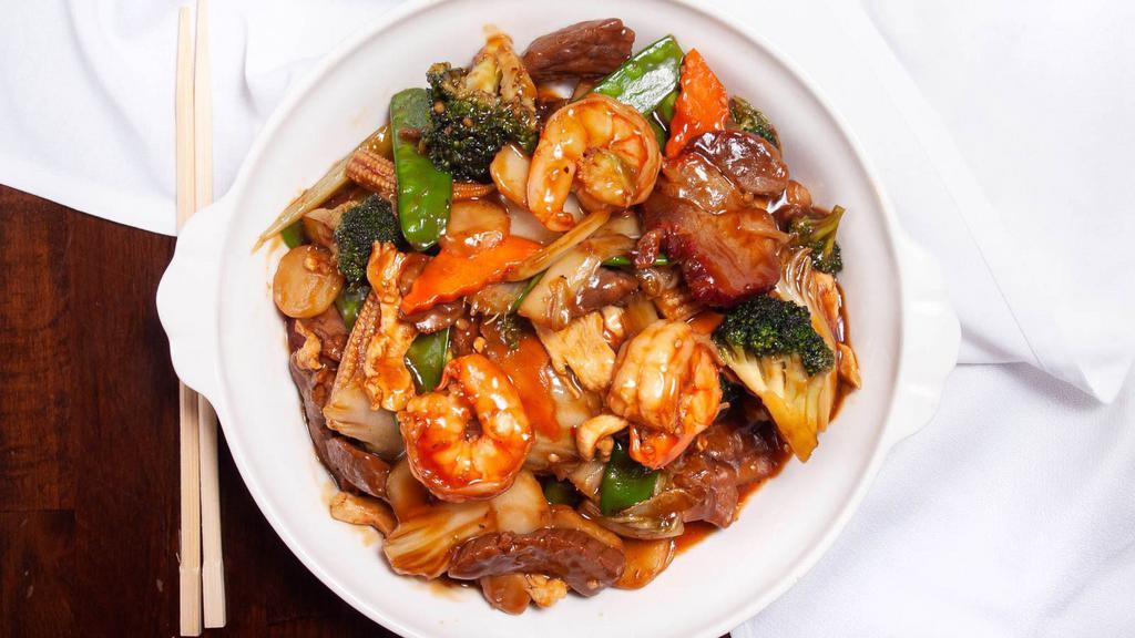 Four Happiness · Shrimp, sliced flank steak, filet of white meat chicken, and roasted pork, sautéed with assorted Chinese vegetables
