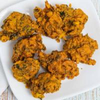 Vegetable Pakora · Assorted fresh vegetable fritters, fried, and delicately spiced.