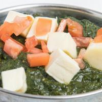 Palak Paneer · Freshly minced spinach cooked with homemade cheese cubes.