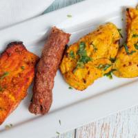 Mixed Grill · Combination of grilled salmon, lamb seekh kabob, and chicken tikka.