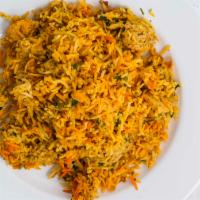 Chicken Biryani · Chicken sautéed in herbs and mild spices with fragrant rice.