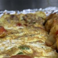 American Omelette · 3 scrambled eggs, bacon, peppers, & onions. Served with wheat, white or rye toast.