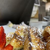 French Toast · Served with maple syrup and butter.