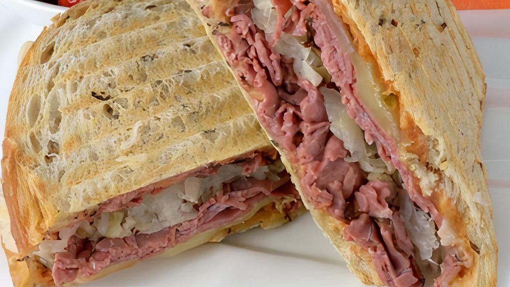 Pastrami And Provolone Panini · Sliced pastrami and provolone cheese with spicy deli mustard, tomatoes, and onions.