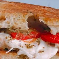 Caprese Panini · Fresh mozzarella, sliced tomatoes, sun-dried tomatoes, and shaved Parmesan cheese with balsa...