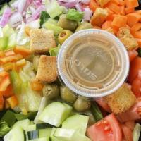 House Salad · Iceberg lettuce, tomato, cucumber, onion, carrots, olives, and choice of dressing.