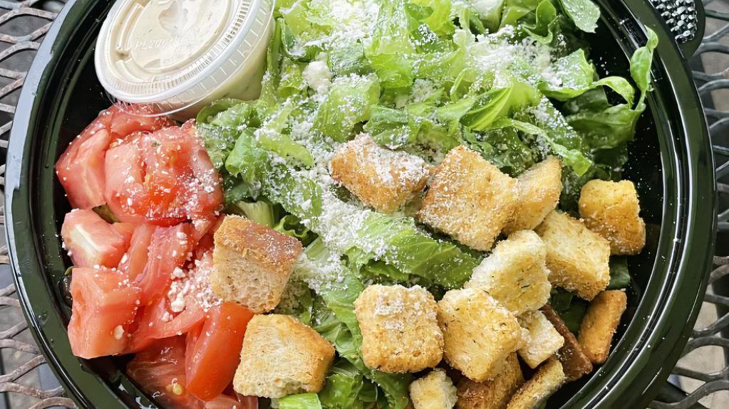 Caesar Salad · Romaine lettuce, grated Parmesan cheese, and croutons with Caesar dressing.