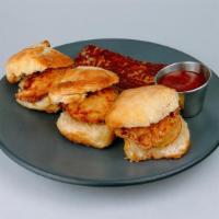 Chicken 'N' Biscuits · Three biscuits, hand-breaded chicken tenders, honey drizzle, mumbo sauce, and hash browns.