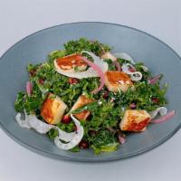 Halloumi Kale Salad · (v) grilled halloumi, picked onions, candied almonds, pomegranate seeds, everything seasonin...