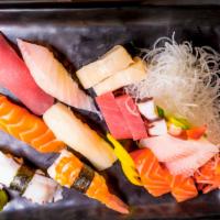 Sushi & Sashimi (16 Pcs) · Tuna, Salmon, Red snapper, White tuna, Yellowtail, Ebi (nigiri), Assorted sashimi.