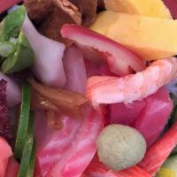 Chirashi · Sliced Assorted fish and fresh veggies over sushi rice.