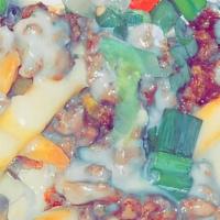 Loaded Fries · Topped with cheese, bacon,green onions, and sour cream