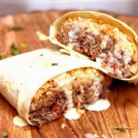 Super Burrito · Our mouth-watering tortilla filled with tender grilled to perfection beef steak, Mexican ric...