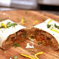Ground Beef Burrito · Our tortilla filled with our famous ground beef, Mexican rice, refried beans, and pico de ga...