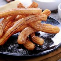Churros · The most popular Mexican dessert. Order of four fried pastries made from an unsweetened doug...
