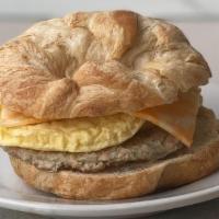 Breakfast Sandwich · Fresh baked croissant with egg, Colby cheese and meat