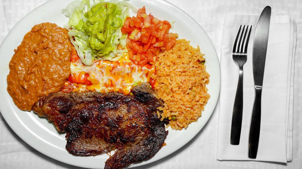 #8. Tampiqueña Style Plate · Steak served with one cheese enchilada, rice, beans & guacamole salad.