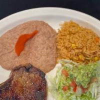 Pork Chops Plate  · Served with: rice, beans, guacamole salad, pico de gallo and two tortillas