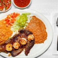 #22. Steak And Shrimp Plate · Steak & Grilled Shrimp, served with rice, beans & guacamole salad.