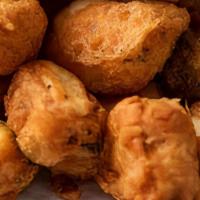 #41. Paneer Pakora · Home-made Indian cheese balls, batter dipped and fried to golden perfection.