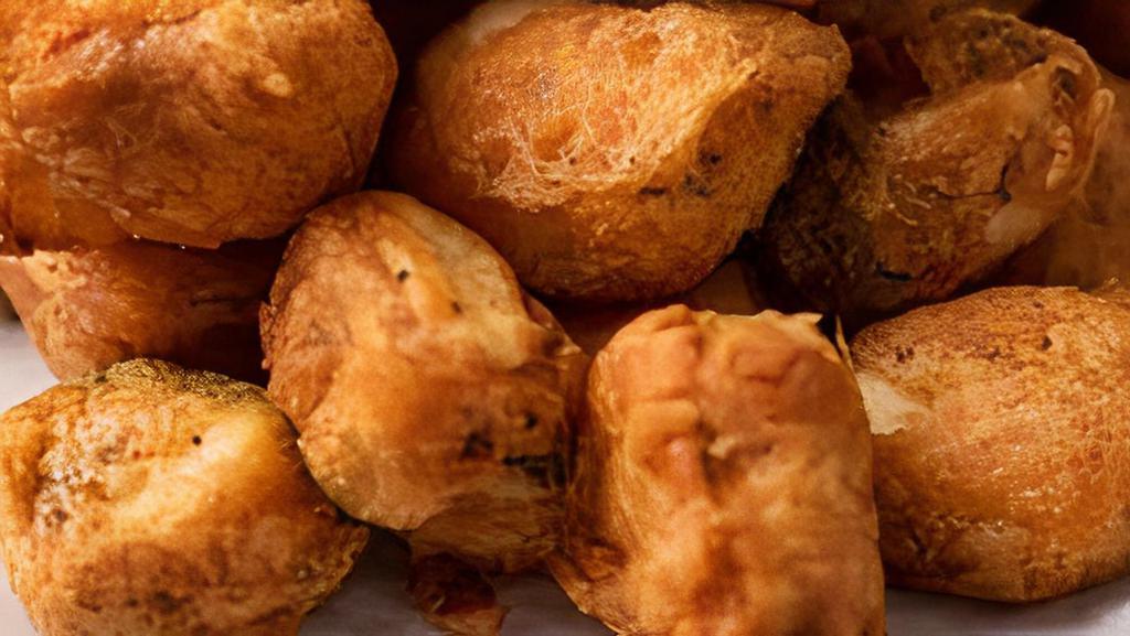 #41. Paneer Pakora · Home-made Indian cheese balls, batter dipped and fried to golden perfection.