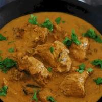 #119. Chicken Korma · Succulent chicken pieces delicately flavored with coconut and gently simmered in yogurt with...