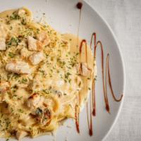 Fettuccine Alfredo · fettuccine pasta tossed with a creamy parmesan, garlic and white wine sauce