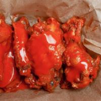 Crispy Buffalo Wings · Eight piece buffalo wings served with hot, mild, honey BBQ, garlic parmesan, or africano.