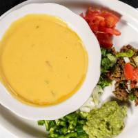 Chili Con Queso · Melted American cheese served with guacamole, ground beef and pico de gallo on the side. Chi...