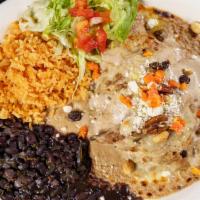 Chile Relleno Al Nogal · Chili poblano pepper stuffed with cheese, vegetables, pastor, chicken or ground beef and top...